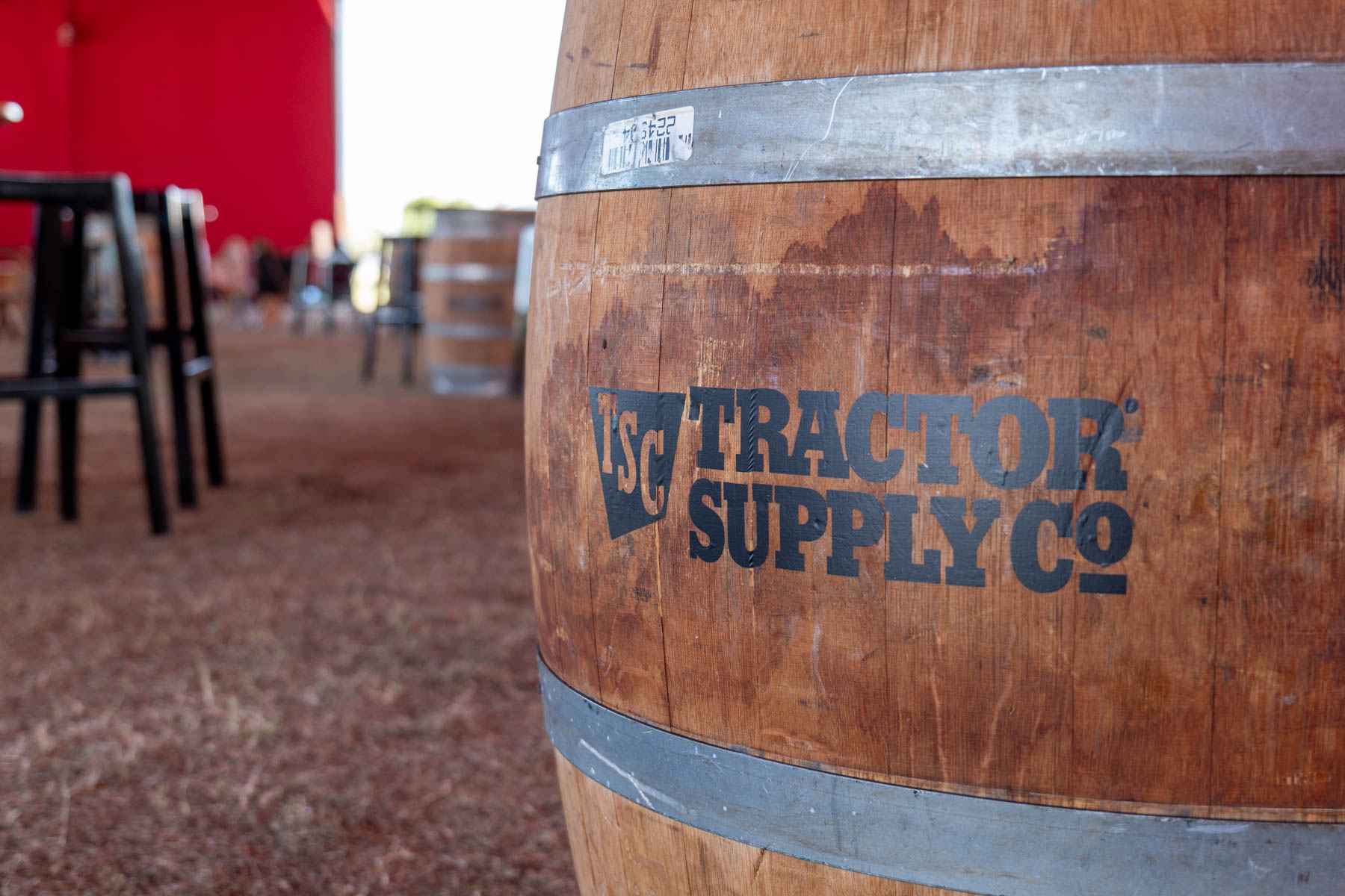 A close-up of a barrel branded with the Tractor Supply Co logo.