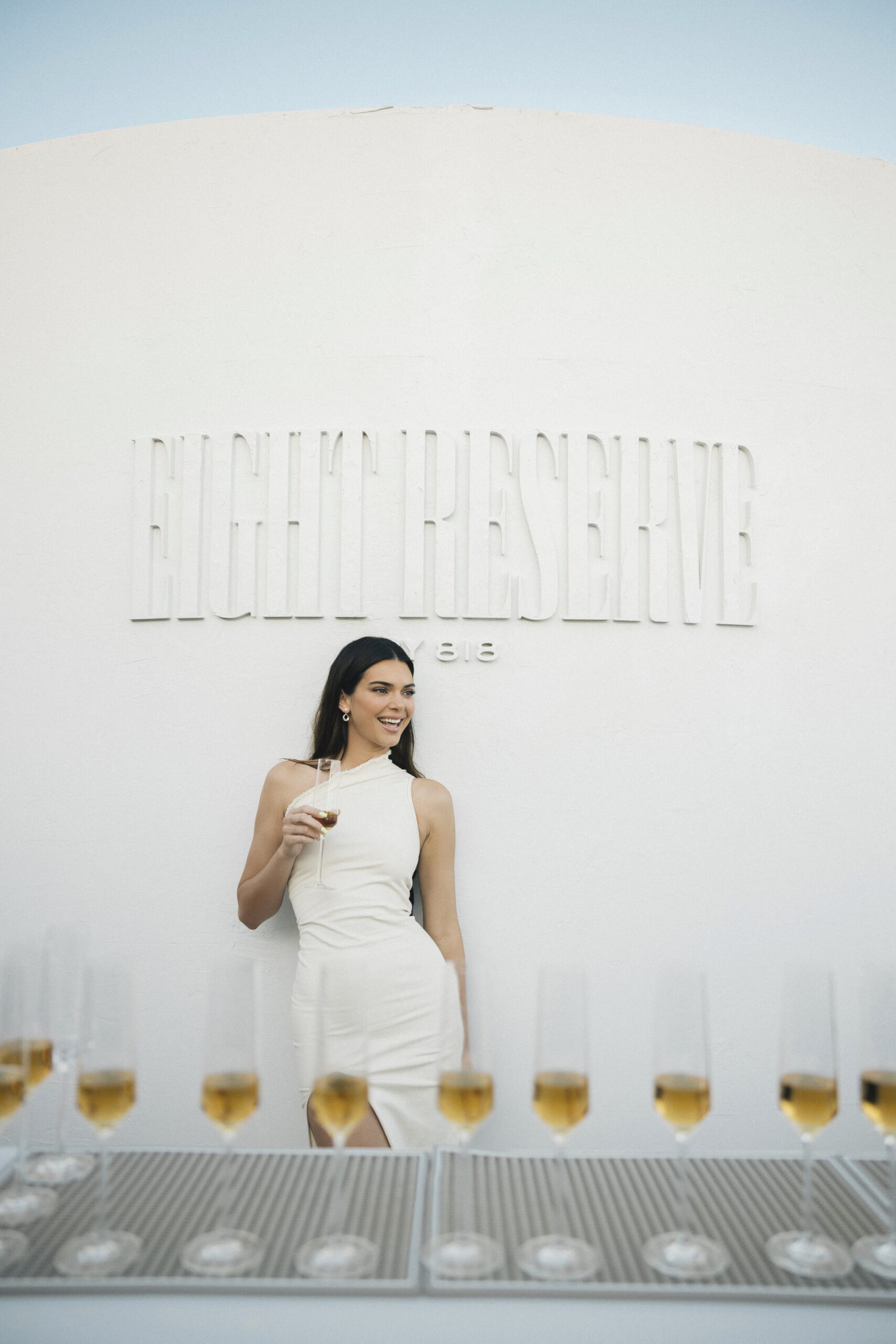 Kendall Jenner posing with a glass of Eight Reserve at the launch party.