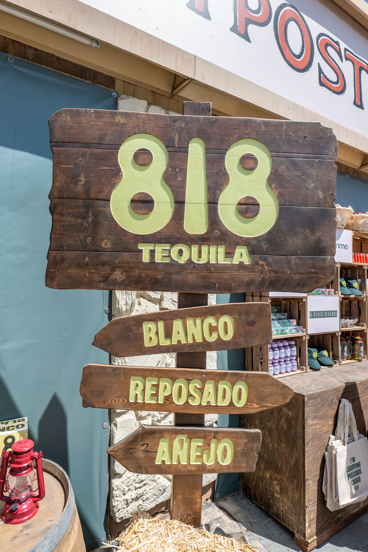 A wooden 818 Tequila sign.