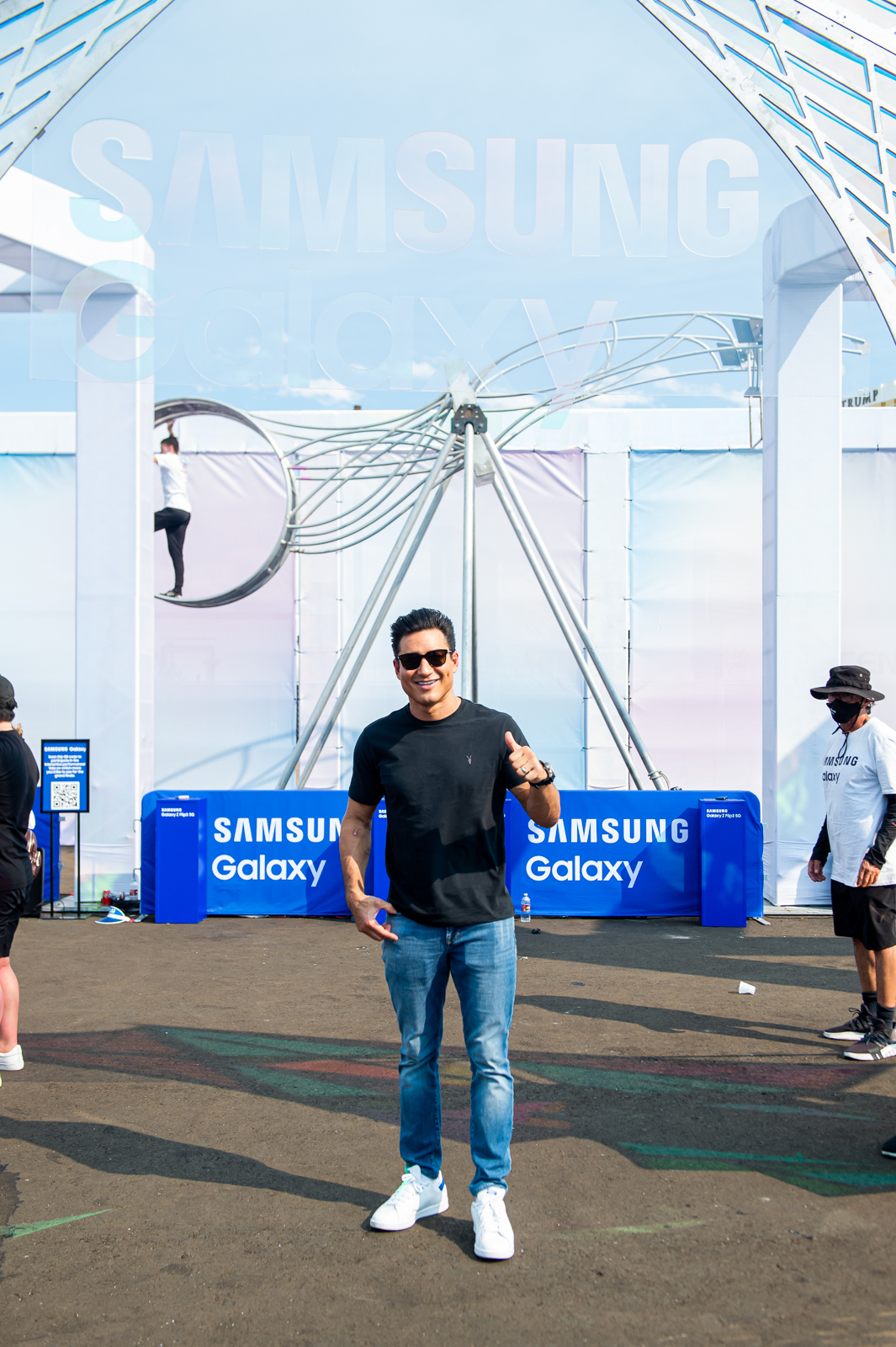 Mario Lopez standing in front of the performance tower.