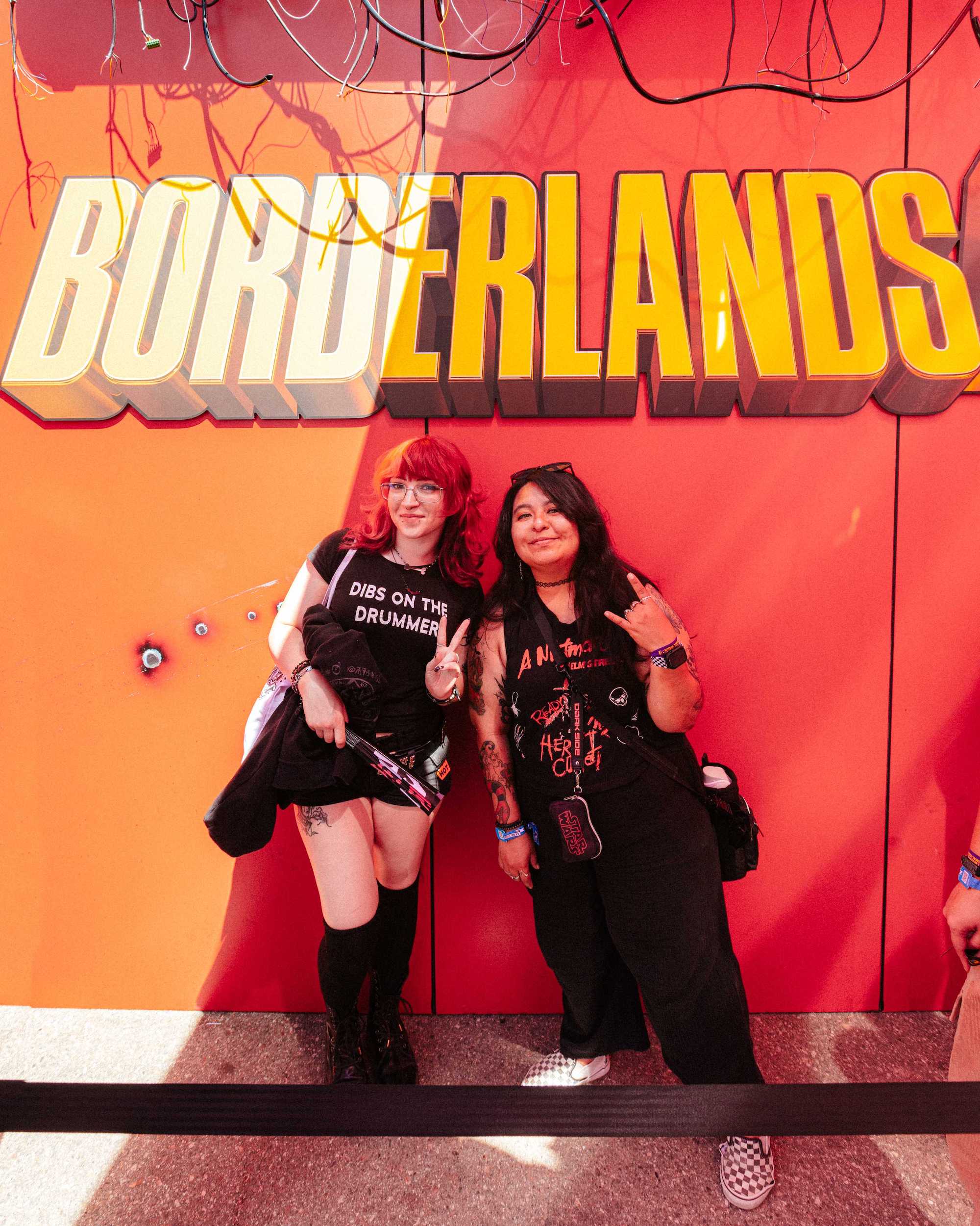 two women at borderlands photo opp
